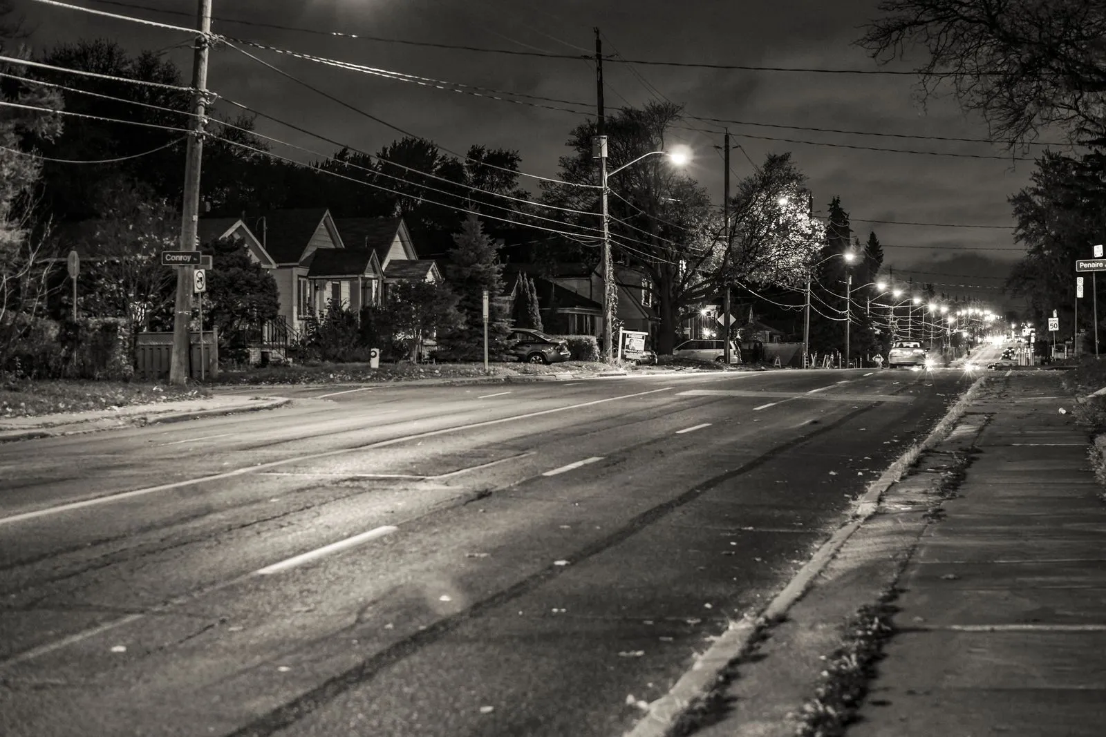 A monochrome night scene of a quiet street in Toronto, Ontario, Canada.